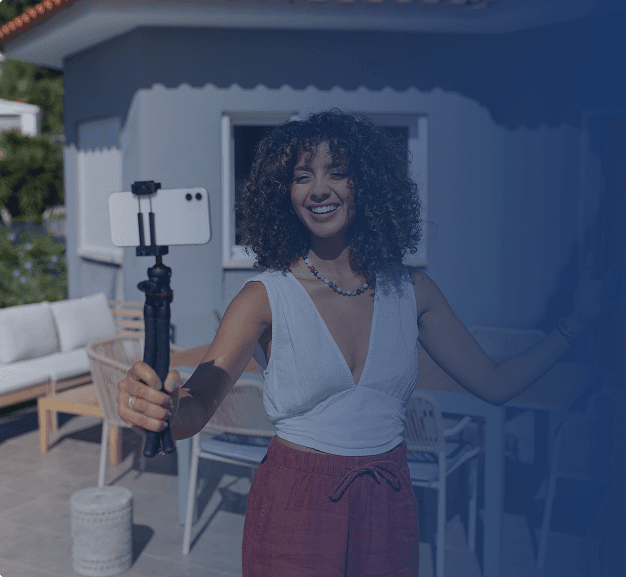 Content creator filming outdoors with smartphone